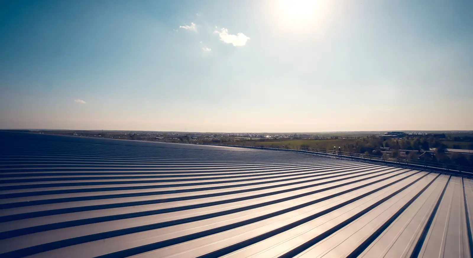 Sky High Roofing crew at work on a commercial building